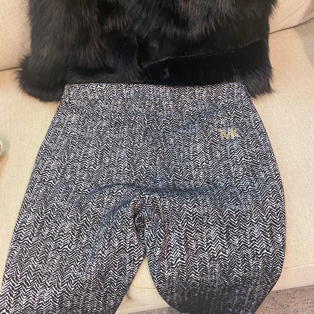 Designer pants and faux furry vest